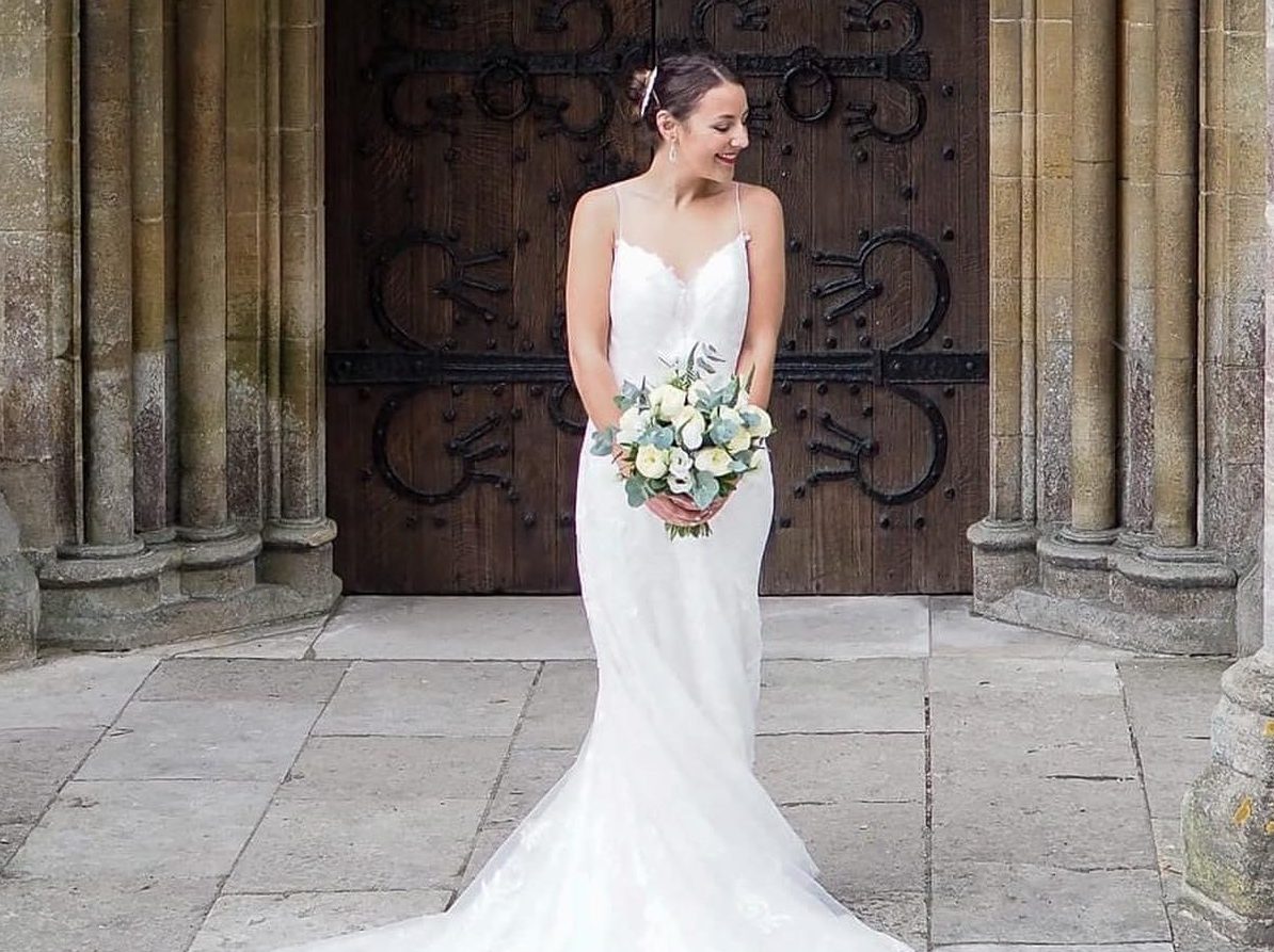 Bride in front of church door